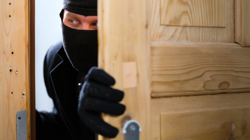A burglar enters a garage and compromises garage security 